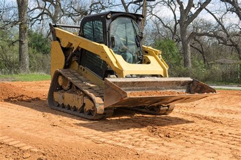 dirt work with skid steer|rough grading skid steer.